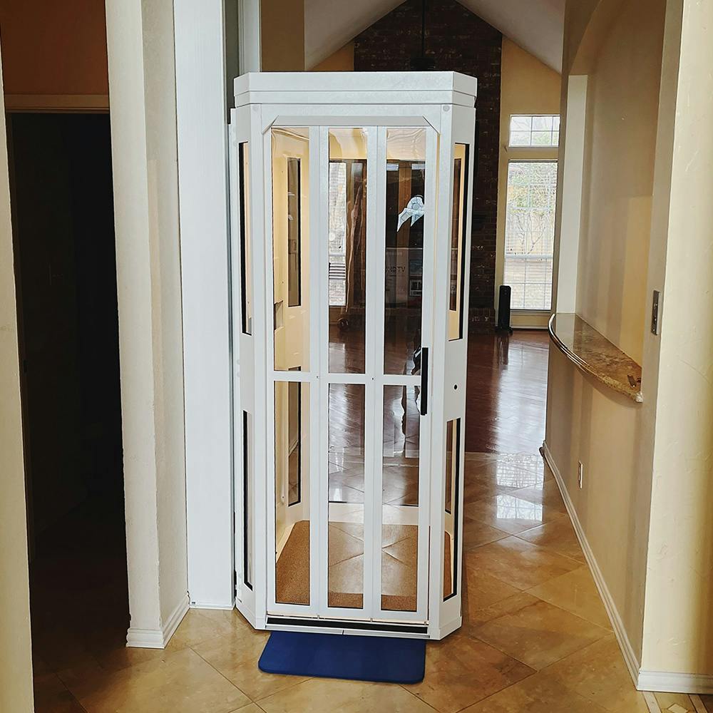 shaftless home elevator in white in the hallway of a house